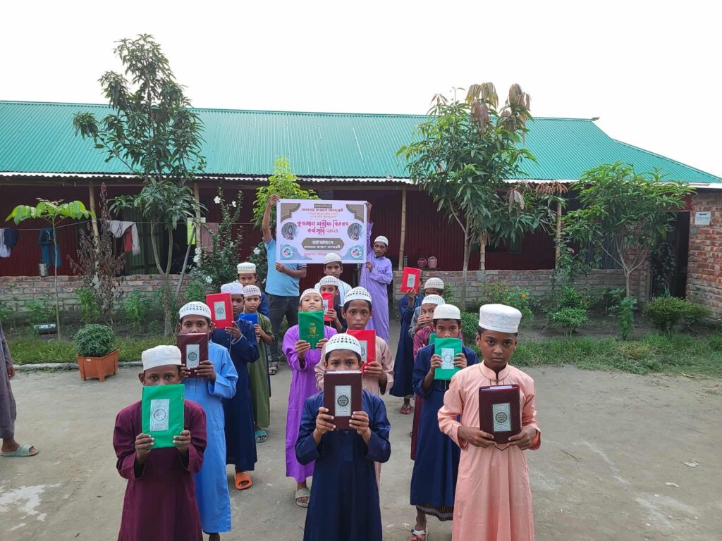 Children receiving educational support materials from Humanity Lovers for Human Welfare